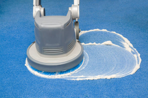 scrubbing blue carpet with machine