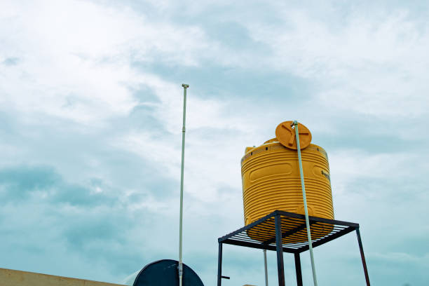 yellow water tank on steel stand